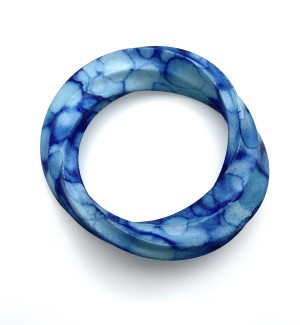 hand dyed blue 3D Printed nylon Bracelet in the shape of a thick curved mobius strip. 