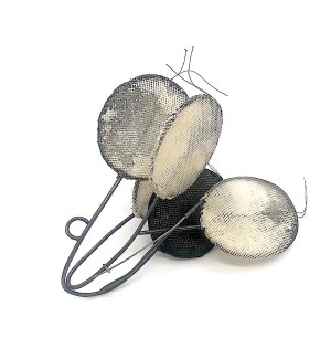 Sculptural Brooch made with oxidized sterling silver and black, gray, and white fabric disks.