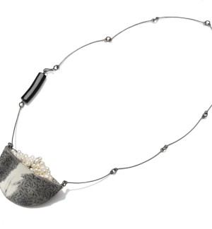 oxidized sterling silver Sculptural Necklace with hand-stitched fabric pendant and beads.