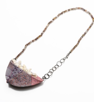 oxidized sterling silver and bead necklace with hand-stitched fabric pendant with beads.