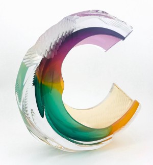 curving Glass Sculpture with irregular spiraling and patterned elements featuring purple, pink, gold and green color swaths that blend together.