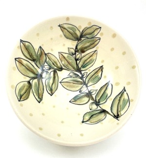 Ceramic hand painted Bowl with green and yellow plant pattern and dots.