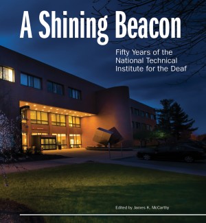 book cover of 'A Shining Beacon - Fifty Years of the National Institute for the Deaf' featuring a photograph of the front of the National Technical Institute for the Deaf building at night.  
