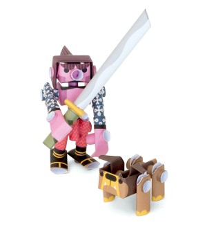 3D paper craft figures of a character wielding a sword and a dog.