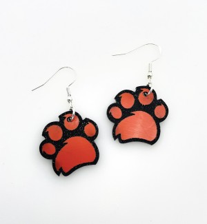 Laser cut acrylic dangle Earrings of the Rochester Institute of Technology Paw Pride logo.