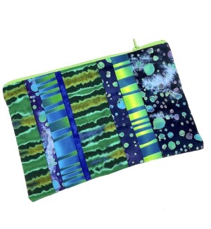 hand sewn Zipper Bag with various sections pieced together featuring green and blue striped and dot patterns. 