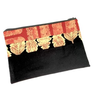 hand sewn Zipper Bag with a black section, a gold leaf on black pattern section, and an abstract orange and red pattern section.