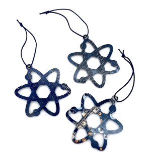 Three blue scientific atom shaped ornaments made of cut circuit board hung on a blue string.