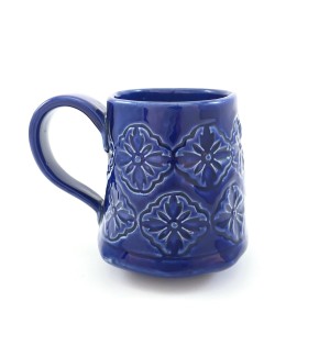 Handbuilt blue Ceramic Mug stamped with floral pattern.