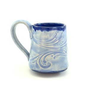 Handbuilt blue Ceramic Mug stamped with decorative pattern with a deeper blue inside.