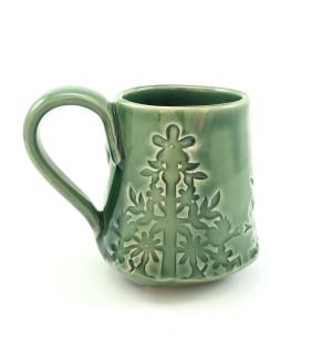 Handbuilt green Ceramic Mug stamped with plant pattern.
