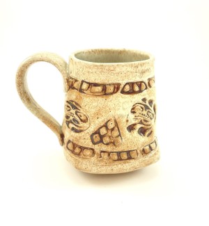 Handbuilt tan and sienna brown Ceramic Mug stamped with abstract pattern.
