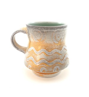 Ceramic Mug with patterns of white and orange with a wash of white, with a pale gray accent tone on the rim, handle, bottom and inside.
