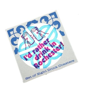 A packaged Letterpress blue and pink Coasters that say 'I'd Rather Drink in Rochester' and feature an illustration of hands holding drinks with the Rochester flower city logo in the background. 
