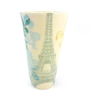 White porcelain tumber with image of Eiffel Tower.