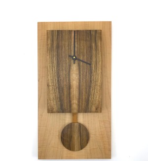 Rectangular clock body and face with short pendulum made from wood.