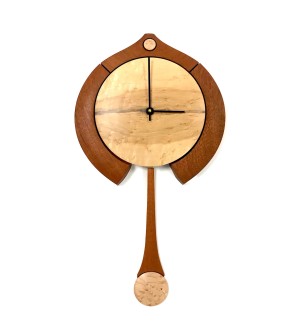 Wooden light round clock face with different toned decorative framing and long swooping pendulum.