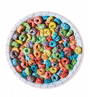 Round jigsaw puzzle in the shape of a circle with image of a bowl of multi-colored cereal.