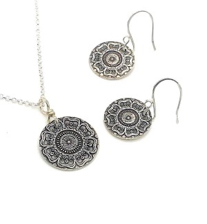 Sterling Silver round Pendant and earrings with a floral mandala pattern on it.