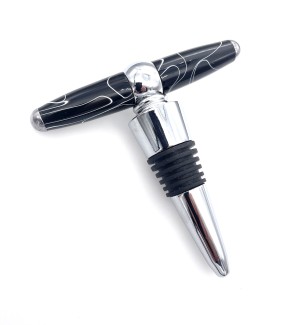 A combo corkscrew and bottle stop made of polished chrome with a striated rubber gasket and a turned acrylic handle (pull) of turned acrylic that is black with white striations.