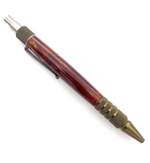 A click style pen with brushed bronze tone hardware and a wood tone body. The click, the clip and tip are brushed bronze.