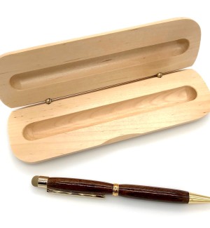 A wood pen with gold hardware pictured next to a hinged wooden box with a slot to hold the pen.