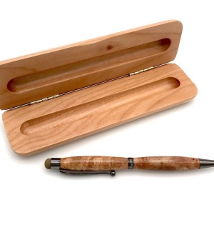 A wood pen with gold hardware pictured inside a hinged wooden box with a slot to hold the pen.