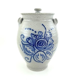 LIdded ceramic vessel with compact side grasp handles. Glaze is light grey with hand illustrated floral decoration in cobalt blue.