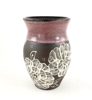 A brown ceramic vase with a rose glazed lip with hand drawn illustrated rose pattern on the center and lower portion..