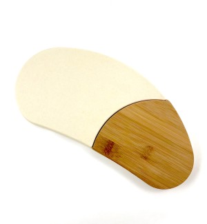 A white, bean shaped serving board with a removable bamboo insert.