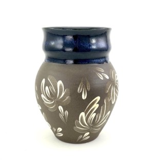A brown ceramic vase with deep blue glazed lip with hand drawn illustrated chrysanthemum pattern on the center and lower portion.