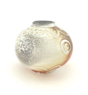 Orb-shaped ceramic vessel with narrow opening and mottled glaze that shifts from greyish white to burnt orange. Subtle spiral pattern emerges randomly over the surface. 
