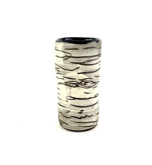 A tall and slender white ceramic vase that resembles a cut white birch branch.