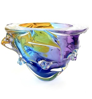 irregular round  funnel shaped Glass Bowl with protruding elements featuring yellow, blue, and purple color swaths that blend together.