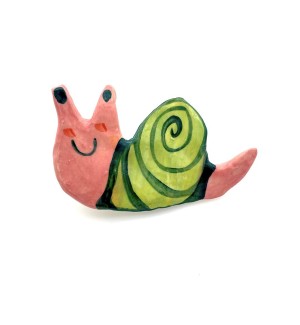Handformed ceramic pin in the shape of a cartoonish snail with a pink smiley face and bright green shell.