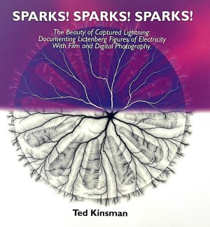 Book cover 'Sparks, Sparks, Sparks' with an electron image of a circular electrical spark that looks like shooting lightning bolts radiating from a center core overlayed on a pinkish purple and white background.