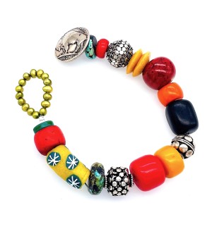 a bracelet made with a colorful assortment of different shaped beads with a coin button clasp.