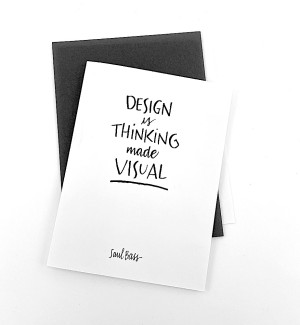 White paper greeting card with calligraphy 'Design is Thinking made Visual' on cover. Dark grey envelope.