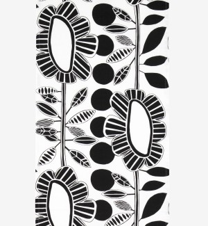 A table runner with a white background and bold graphic representations of oval flowers with striped petals in black and white.  