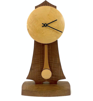 Wooden standing clock with dark curved body and a round light face with a long swooping pendulum on a rounded rectangular base.