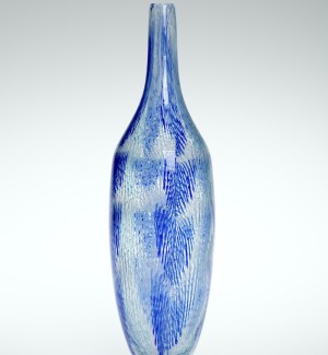 a tall and narrow glass vesel in clear glass with minute blue color hatching that gives the sense of rain drops.