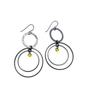 a pair of dangle earrings with earhooks and a trio of grey metal round hoops.