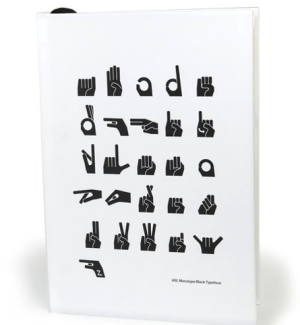 Lined journal with graphic representations of American Sign Language letter signs on the cover.