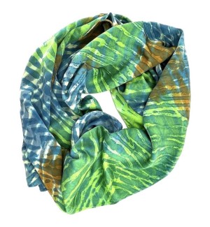 a scarf rolled into a do-nut shape sporting a hatch mark pattern of blended greens, blues and white.