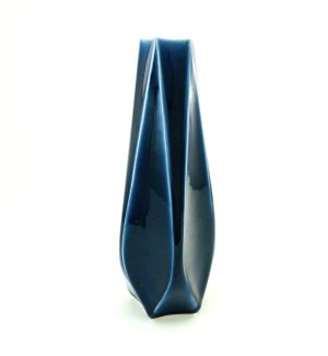 a tall and narrow ceramic vase with facets and carved edges in a cobalt blue with light blue highlights.