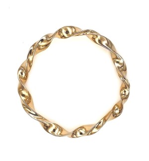 a bronze bangle bracelet that is twisted.