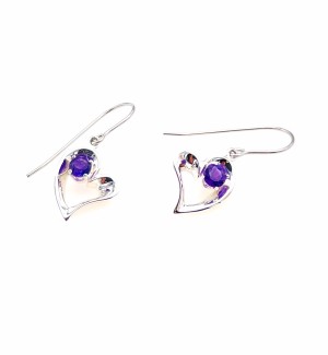 a pair of silver heart shaped earrings each with a purple gem stone.