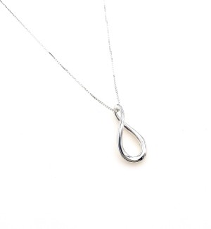 A silver infinity shaped pendant.