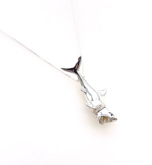a silver detailed 3d pendant of a great white shark.