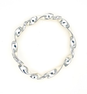 a round silver bracelet with a twisted surface.